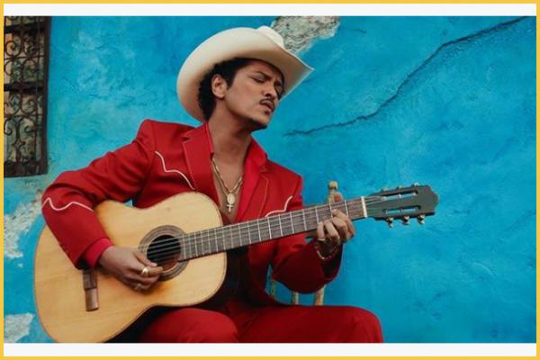 Bruno Mars and D'Mile open The Romantic (Reissue) with "Risk It All", a downtempo pop R&B ballad blending Latin and mariachi touches, where devotion turns into a high-stakes vow.
 img 0